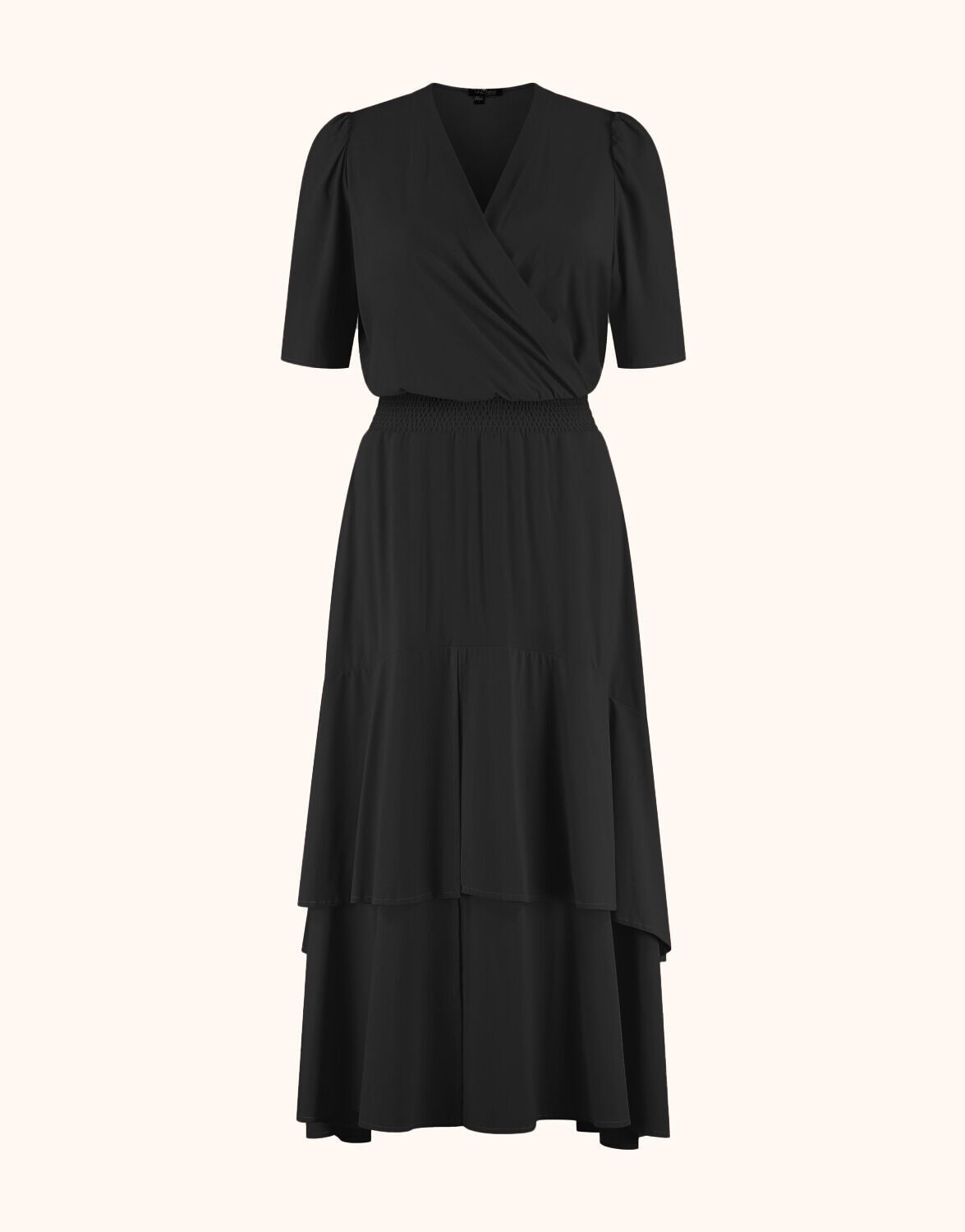Packshot of the Lea Black dress in jersey lycra with a wrap front and tiered hem.