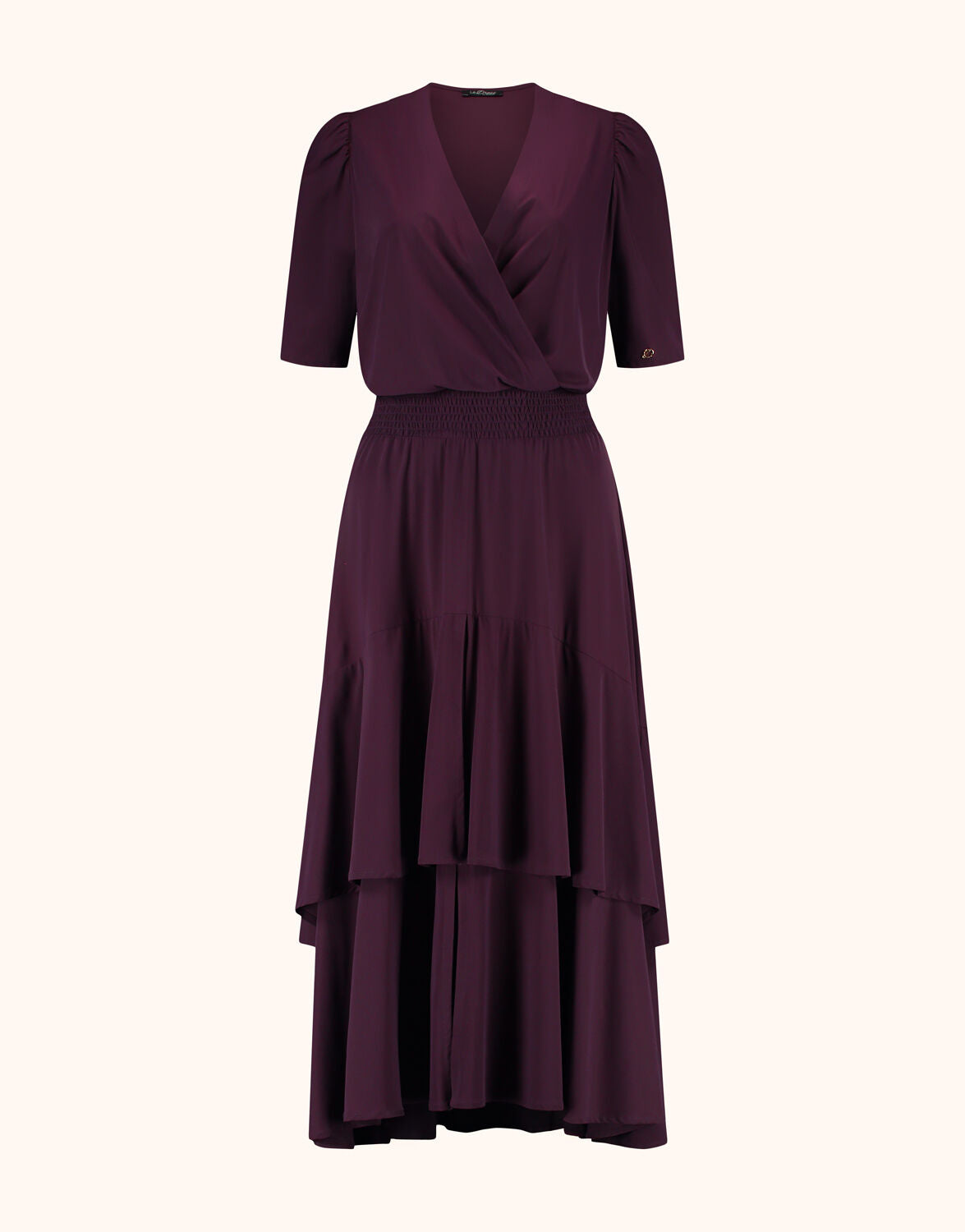 Packshot of the Lea Deep Aubergine dress in jersey lycra with a wrap front and tiered hem.