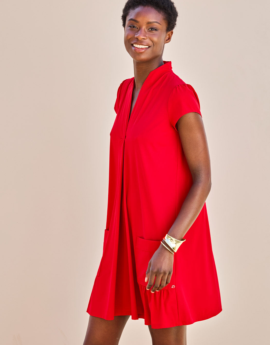 Model standing in the Liana Raspberry Red dress in jersey lycra with cap sleeves.