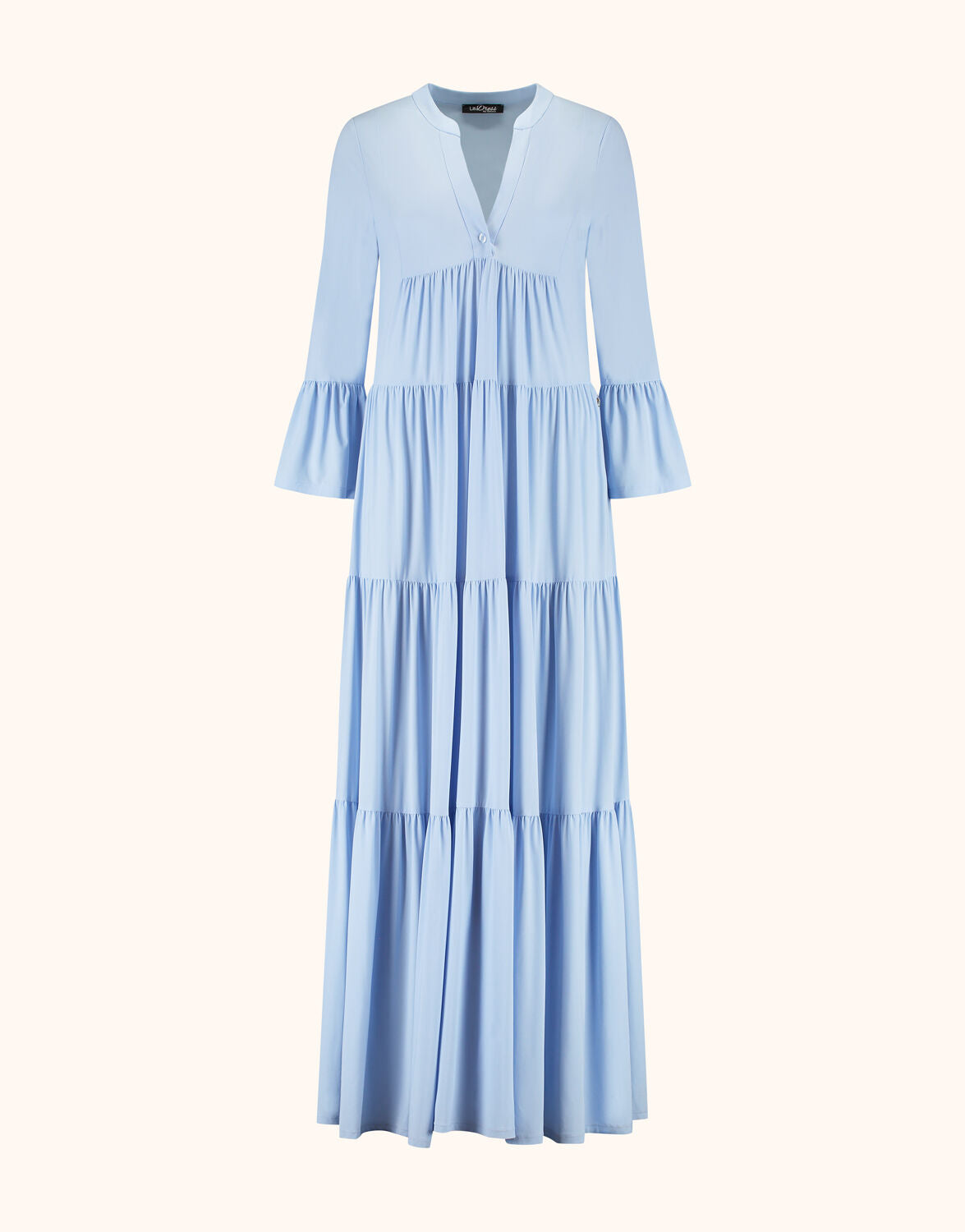 Packshot of the Liora Sky Blue dress in jersey lycra, a long tiered style with flared sleeves.