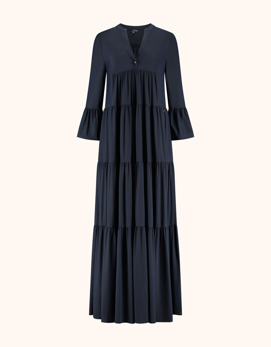 Packshot of the Liora Midnight Blue dress in jersey lycra, a long tiered style.