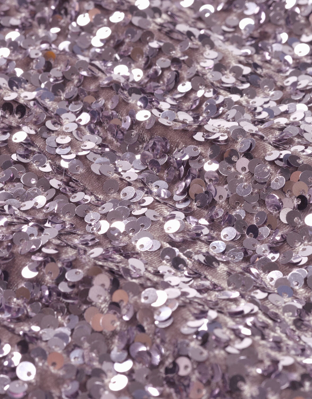 Beautiful lilac glitter fabric with shimmering sequins that give the clothing a luxurious and festive look.