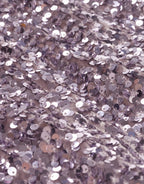 Beautiful lilac glitter fabric with shimmering sequins that give the clothing a luxurious and festive look.