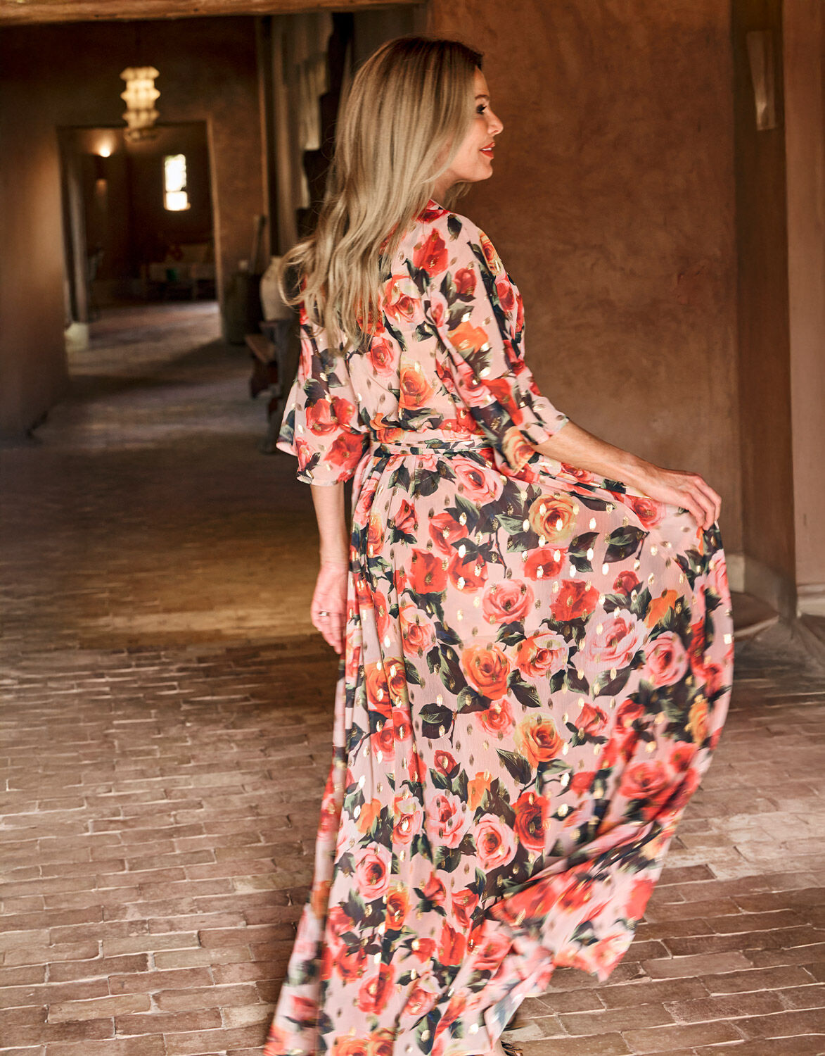 Long floral print dress with pink and orange roses.