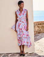 Sleeveless floral dress in pastel blue with pink and white patterns, relaxed summer style for casual occasions.
