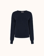 Packshot of the Lucienne Midnight Blue jumper in viscose knit with a round neck and ribbed cuffs.