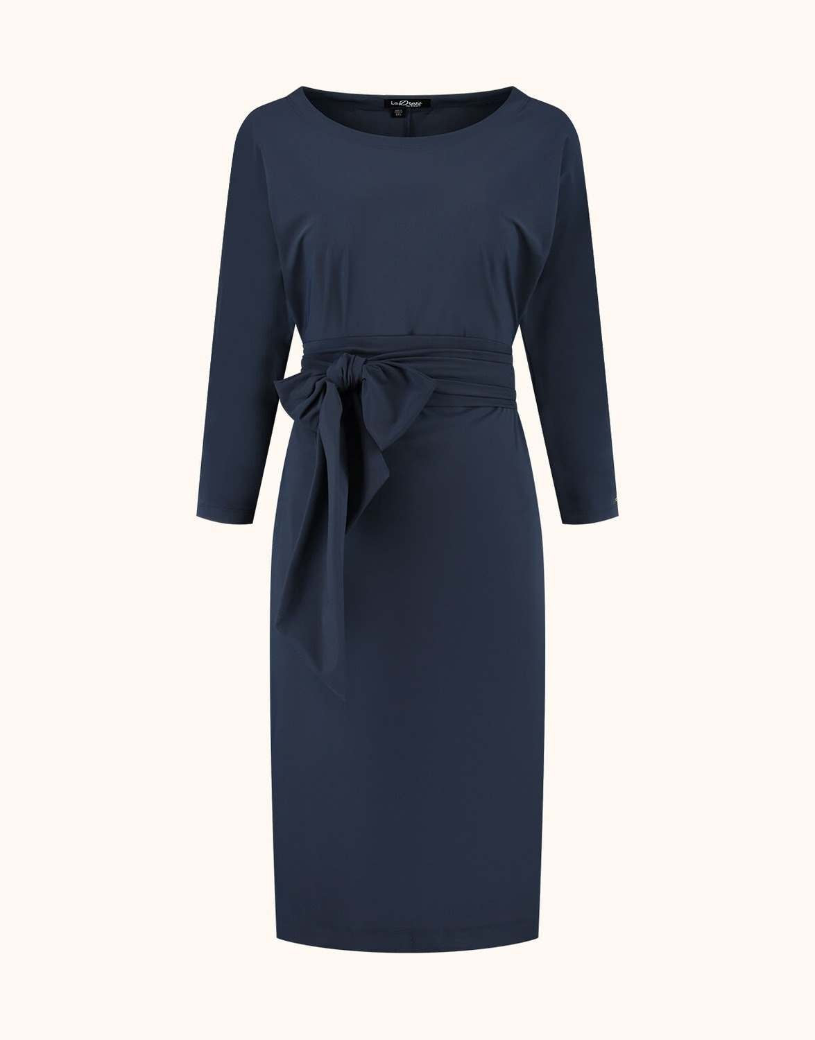 Packshot of the Caroline Midnight Blue dress in jersey lycra with a boat neck and a tie belt.