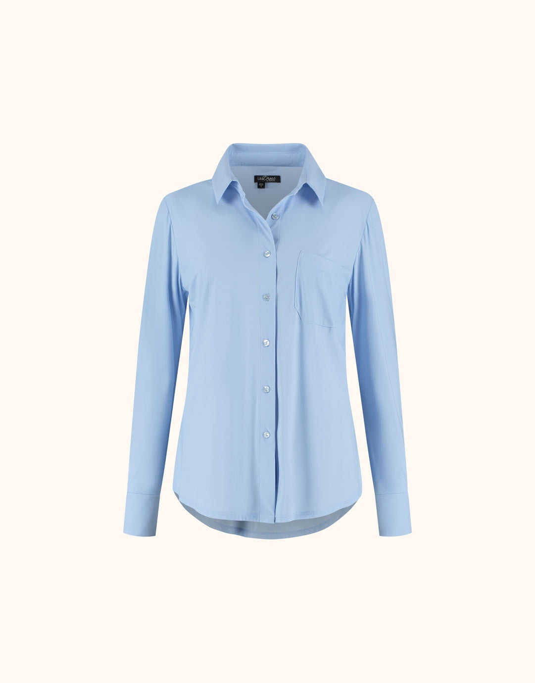 Packshot of the Annie Sky Blue shirt in jersey lycra with a collar and a chest pocket.
