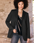 Elegant black ladies' blazer with a shiny sequin top, perfect for a stylish and sophisticated look.