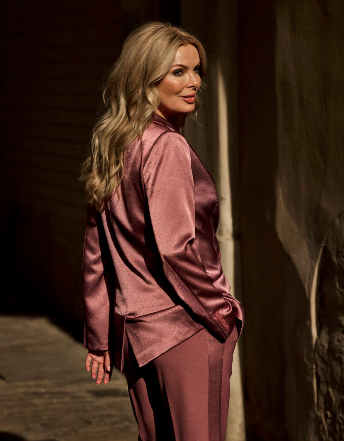 Model standing in the Juliette Dusty pink satin blazer in crepe satin with trousers.