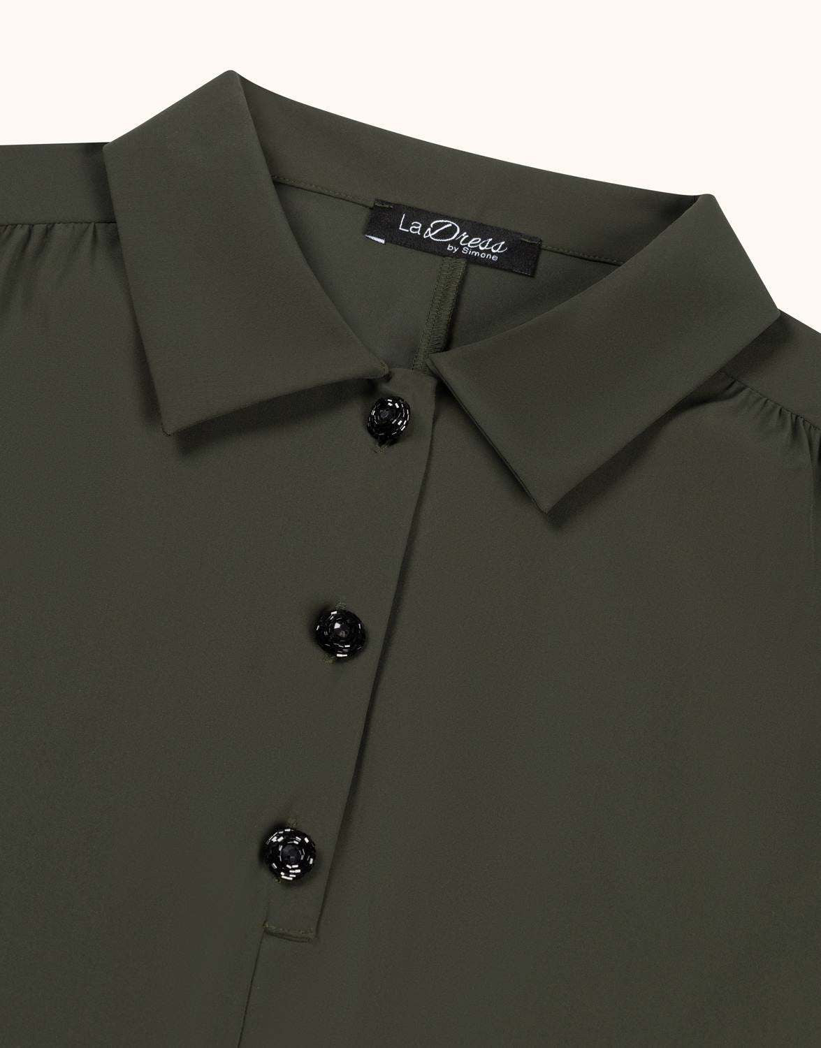 Detail of the Eleanor Deep Moss tunic in jersey lycra, showing the buttons and collar.