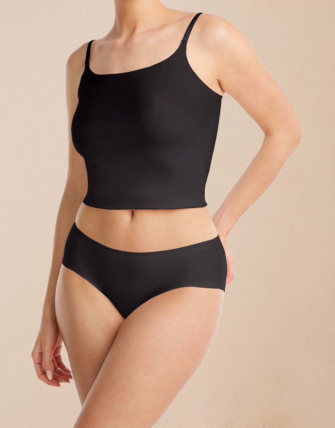 Model standing in the Noa 2-pack Black/Nude shaping brief in jersey lycra in the black shade.