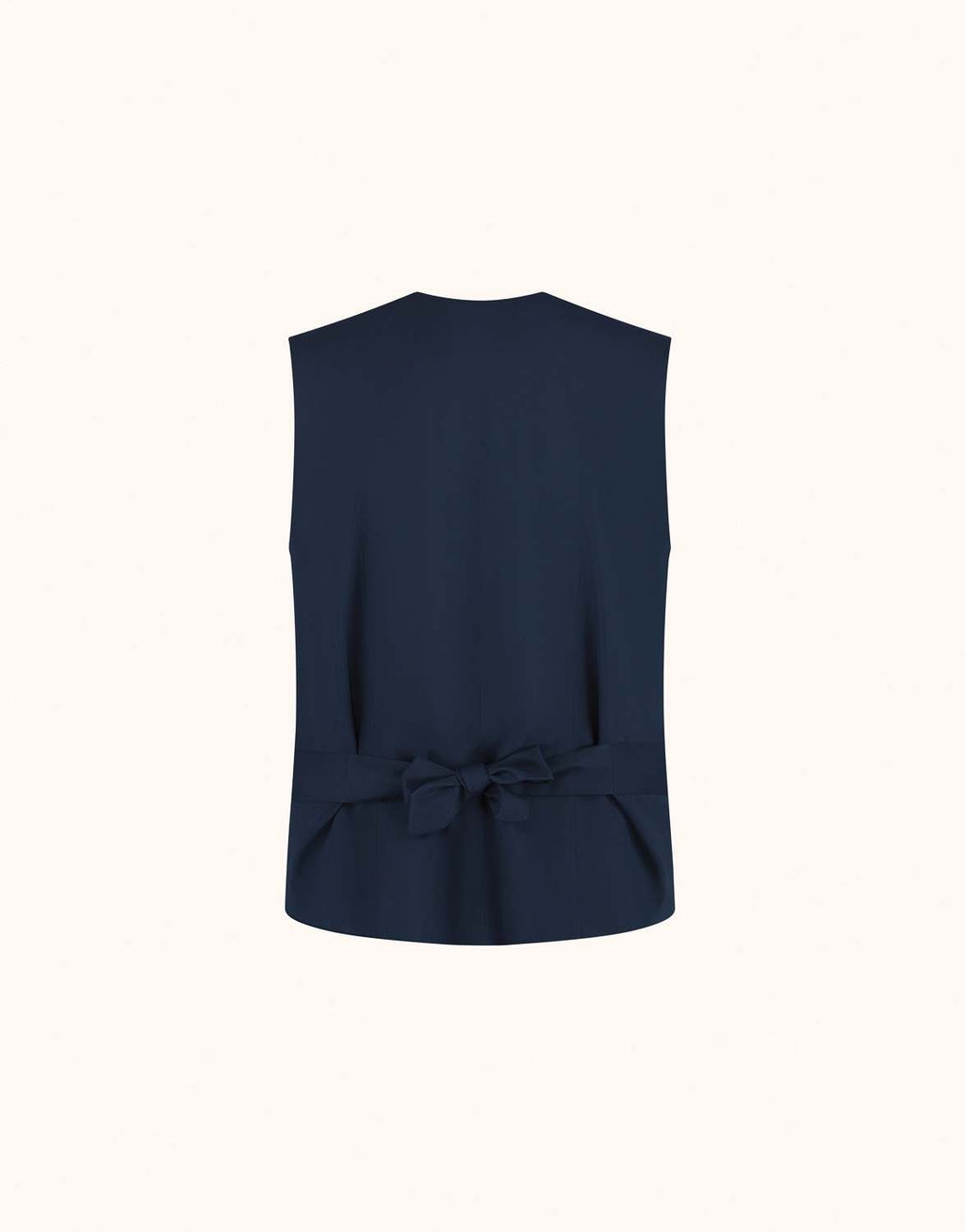 Packshot of the Jolene Midnight Blue waistcoat in crepe satin seen from the back, with a bow.