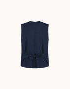 Packshot of the Jolene Midnight Blue waistcoat in crepe satin seen from the back, with a bow.