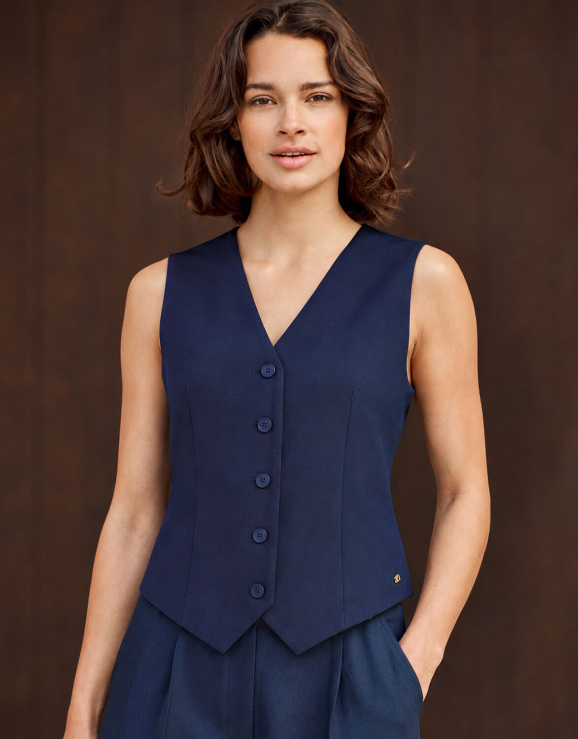 Model standing in the Charlize Midnight Blue waistcoat in crepe satin with matching trousers.