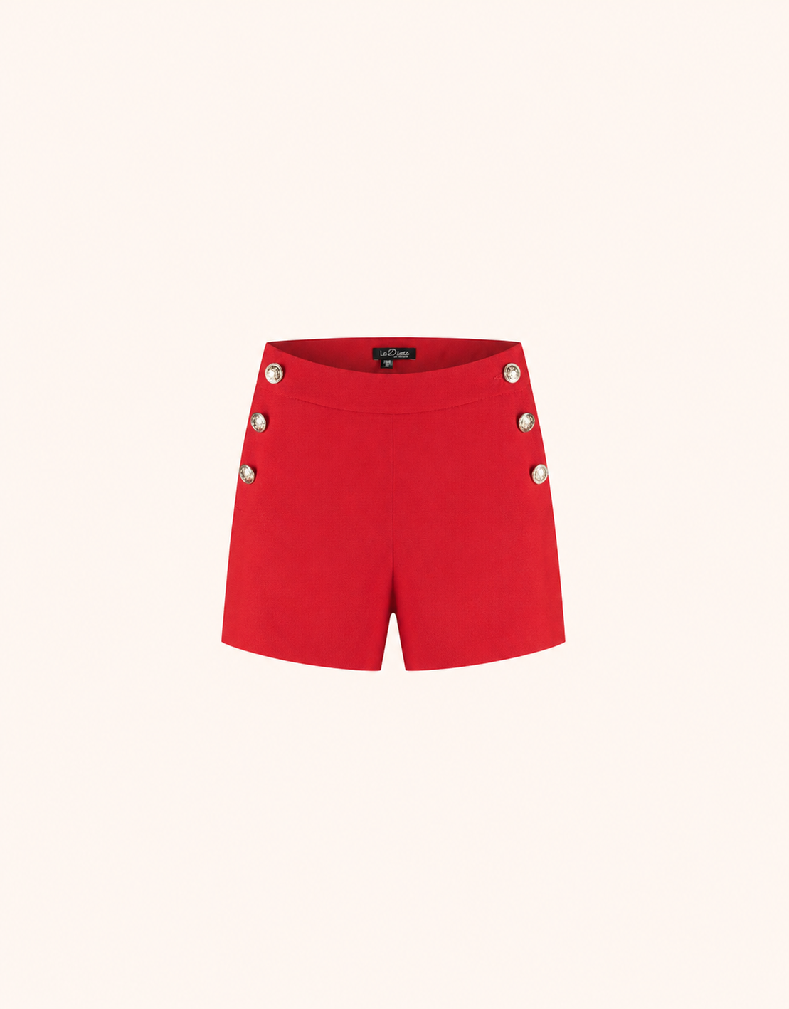 Packshot of the St Tropez Red shorts in crepe satin with gold buttons at the front.