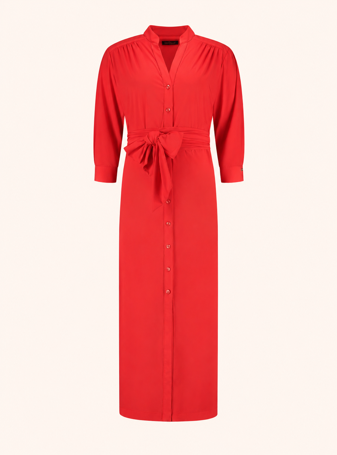 Packshot of the Ethel Hibiscus dress in jersey lycra with a button front and a tie belt.