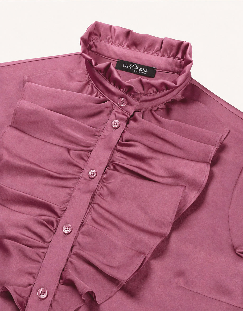 Detail of the Eloise Plum blouse in satin, showing the pleated collar and the ruffled placket.