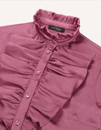 Detail of the Eloise Plum blouse in satin, showing the pleated collar and the ruffled placket.