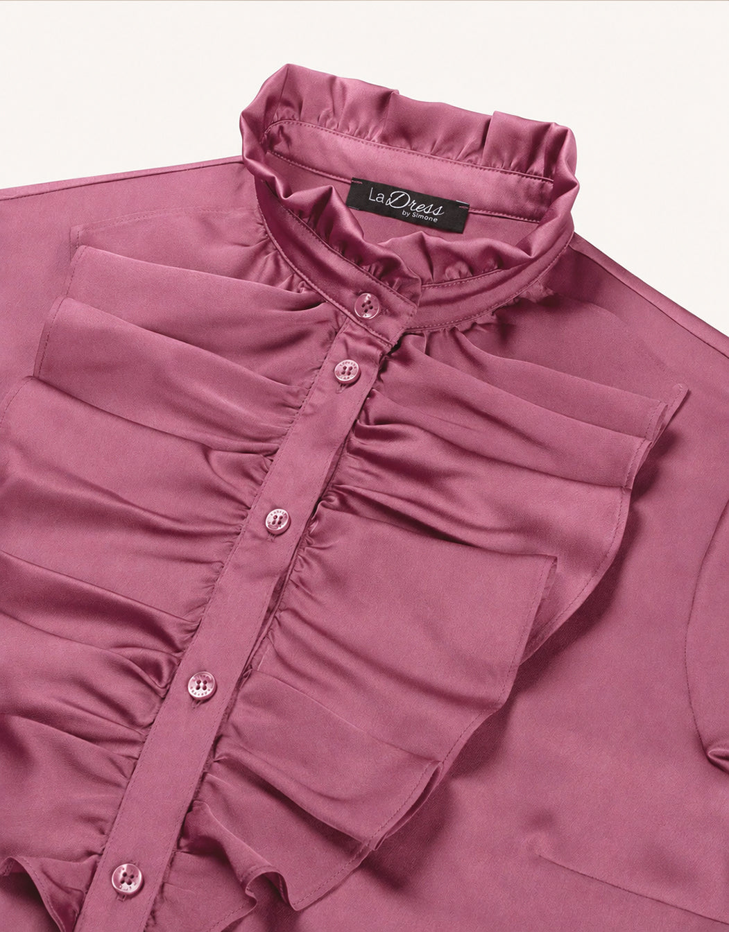 Detail of the Eloise Plum blouse in satin, showing the pleated collar and the ruffled placket.