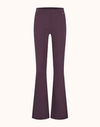 Packshot of the Lima Deep Aubergine trousers in jersey lycra with a high waist.