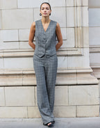 Model standing in the Naples Light Grey Check trousers in stretch woven with the Jules waistcoat.