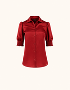 Packshot der Miuccia Deep Crimson Bluse aus Satin mit Kragen und Puffärmeln mit gesmokten Manschetten.