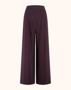 Packshot of the Savona Deep Aubergine trousers in jersey lycra with a wide palazzo leg.