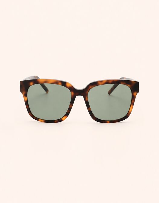 Packshot of the Ann Tortoise sunglasses with a tortoiseshell frame and green lenses.