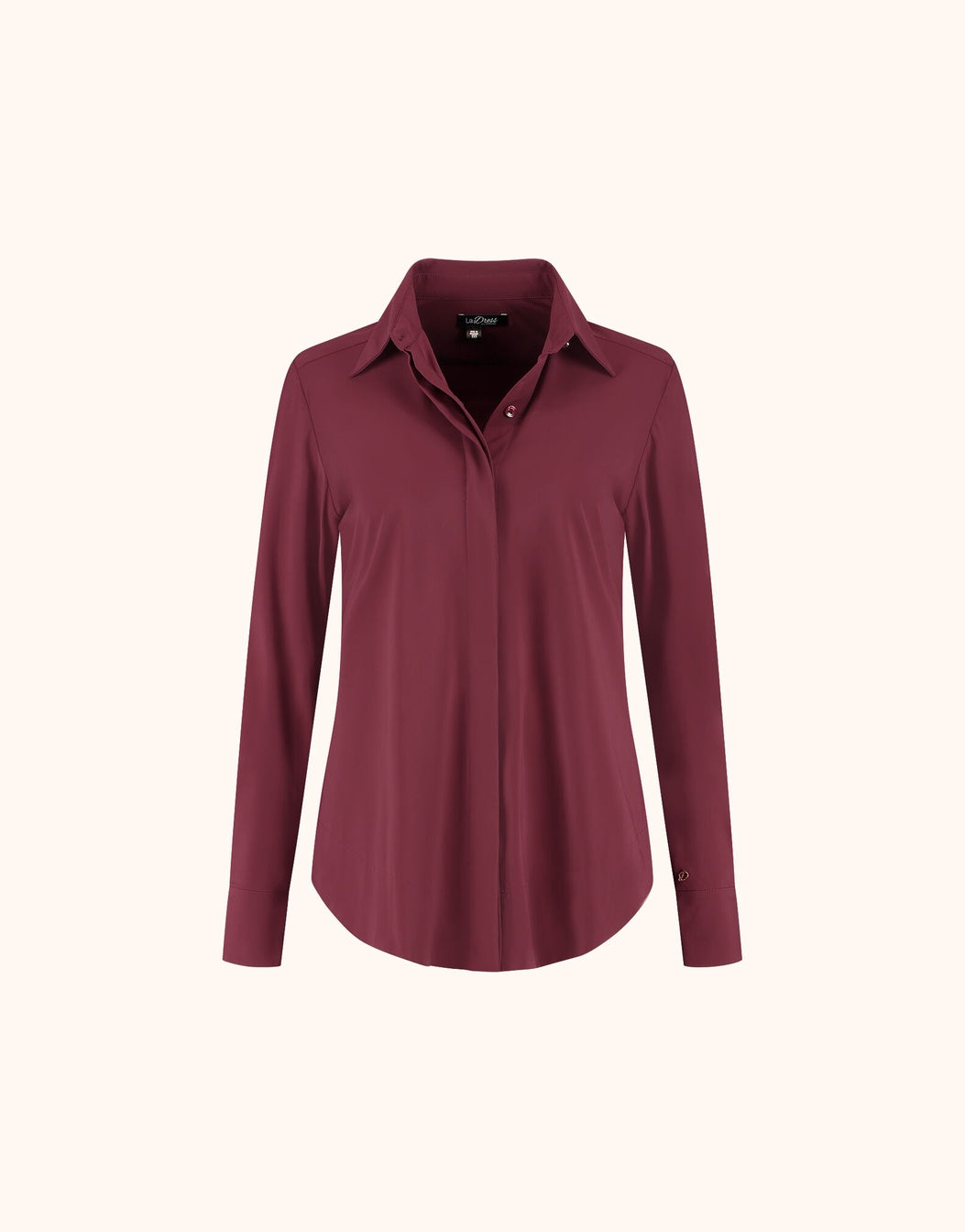 Packshot of the Judi Ruby Red blouse in jersey lycra with a collar and long sleeves.