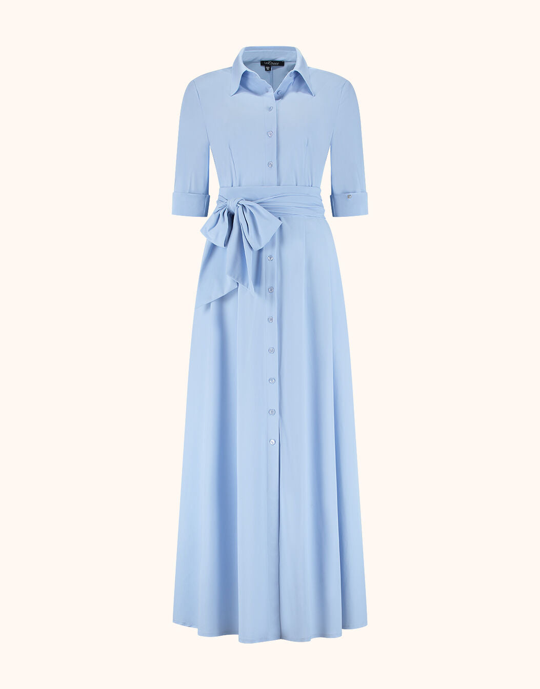 Packshot of the Margot Sky Blue dress in jersey lycra with a collar and tie belt.