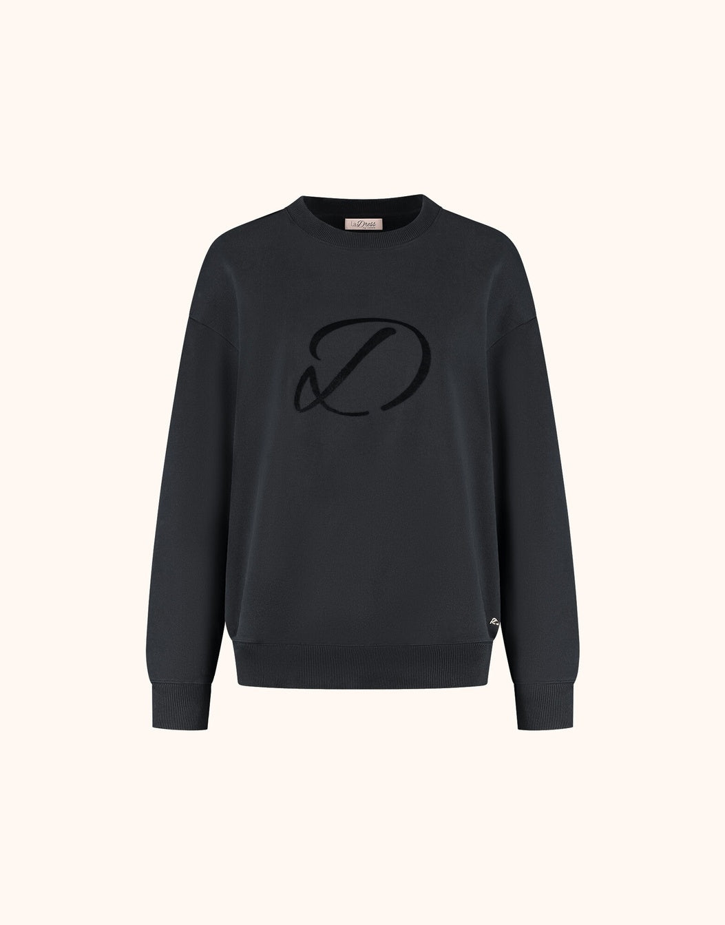 Packshot of the Candy Black sweater in organic certified cotton with a tonal embroidered logo.
