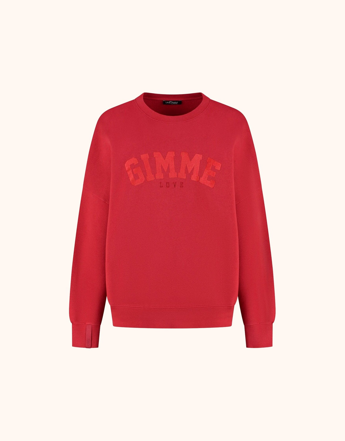 Packshot of the Story Sweater Raspberry Red in organic cotton knit with a GIMME print.
