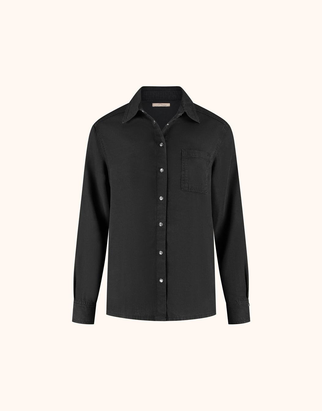 Packshot of the Andrea Black shirt in lyocell denim with a button front and pocket.