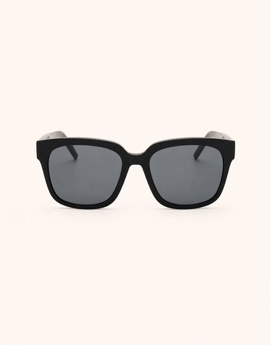 Packshot of the Ann Black sunglasses with a square acetate frame and dark lenses.