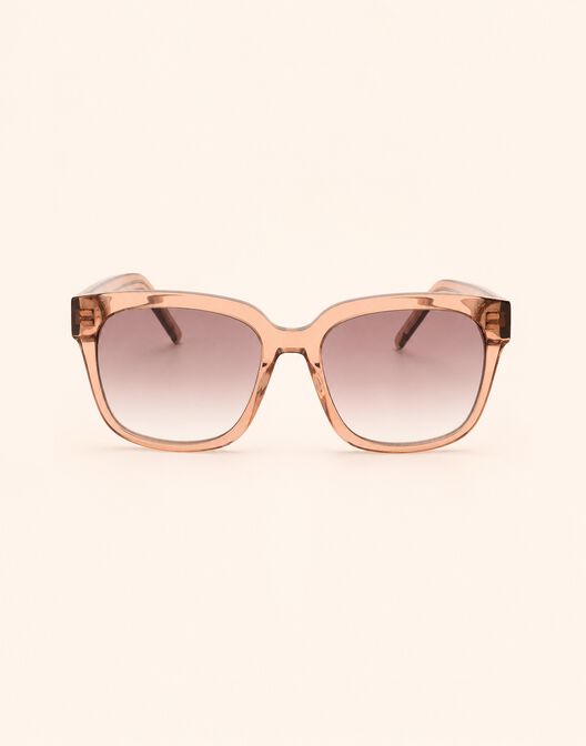 Packshot of the Ann Blush sunglasses with a transparent frame and gradient lenses.