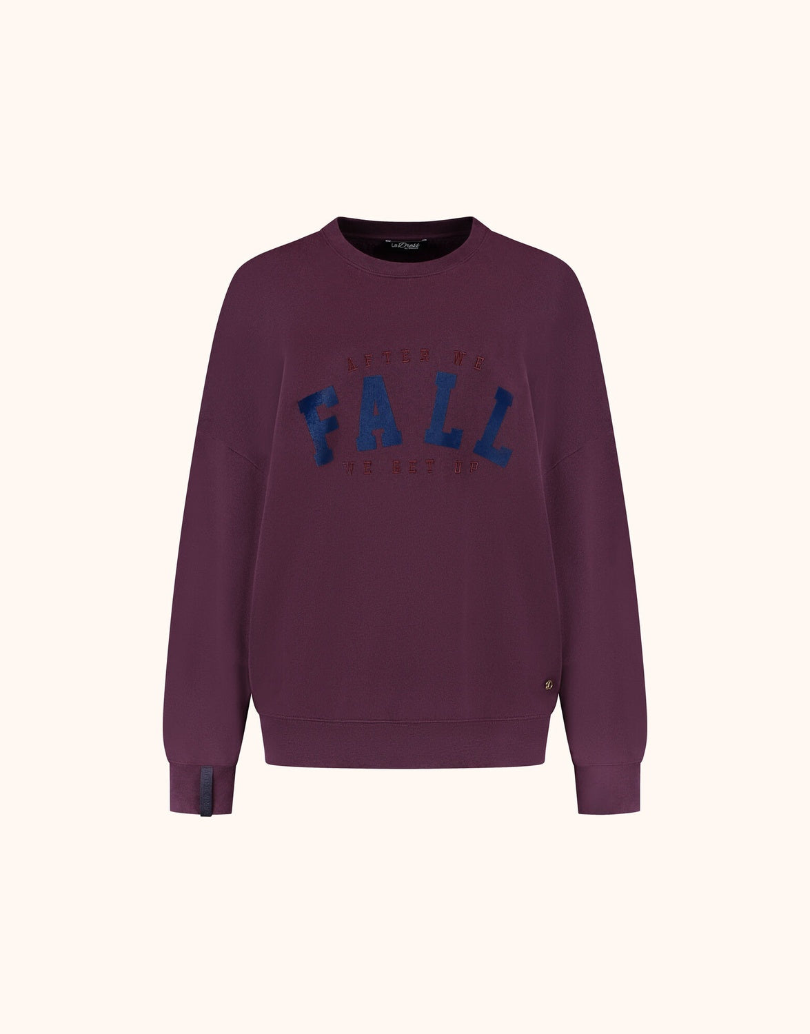 Packshot of the Story Sweater Deep Aubergine in organic cotton knit with a FALL print.