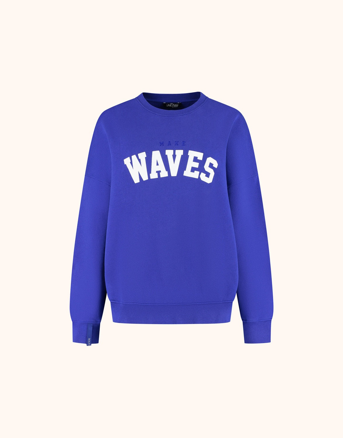 Packshot of the Story Sweater Marine Blue in organic cotton knit with a WAVES print.
