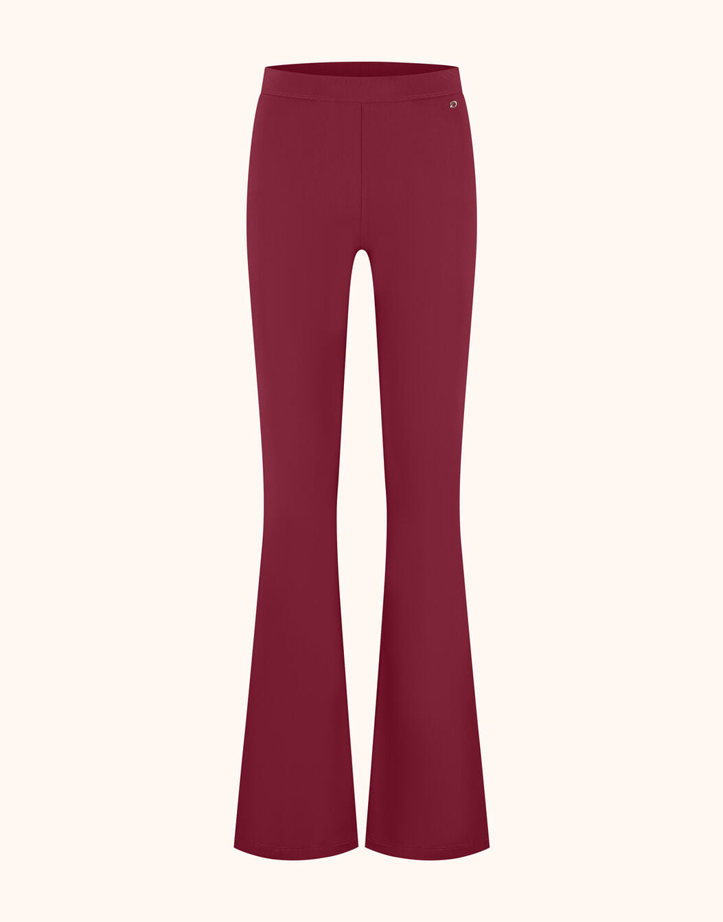 Packshot of the Lima Ruby Red trousers in jersey lycra with a high waist and flared leg.
