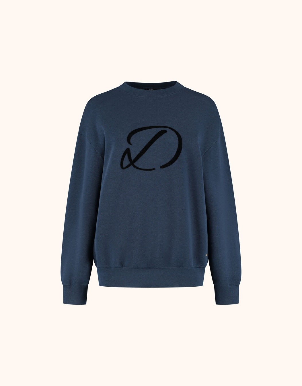 Packshot of the Candy Midnight Blue sweater in organic certified cotton with an embroidered logo.