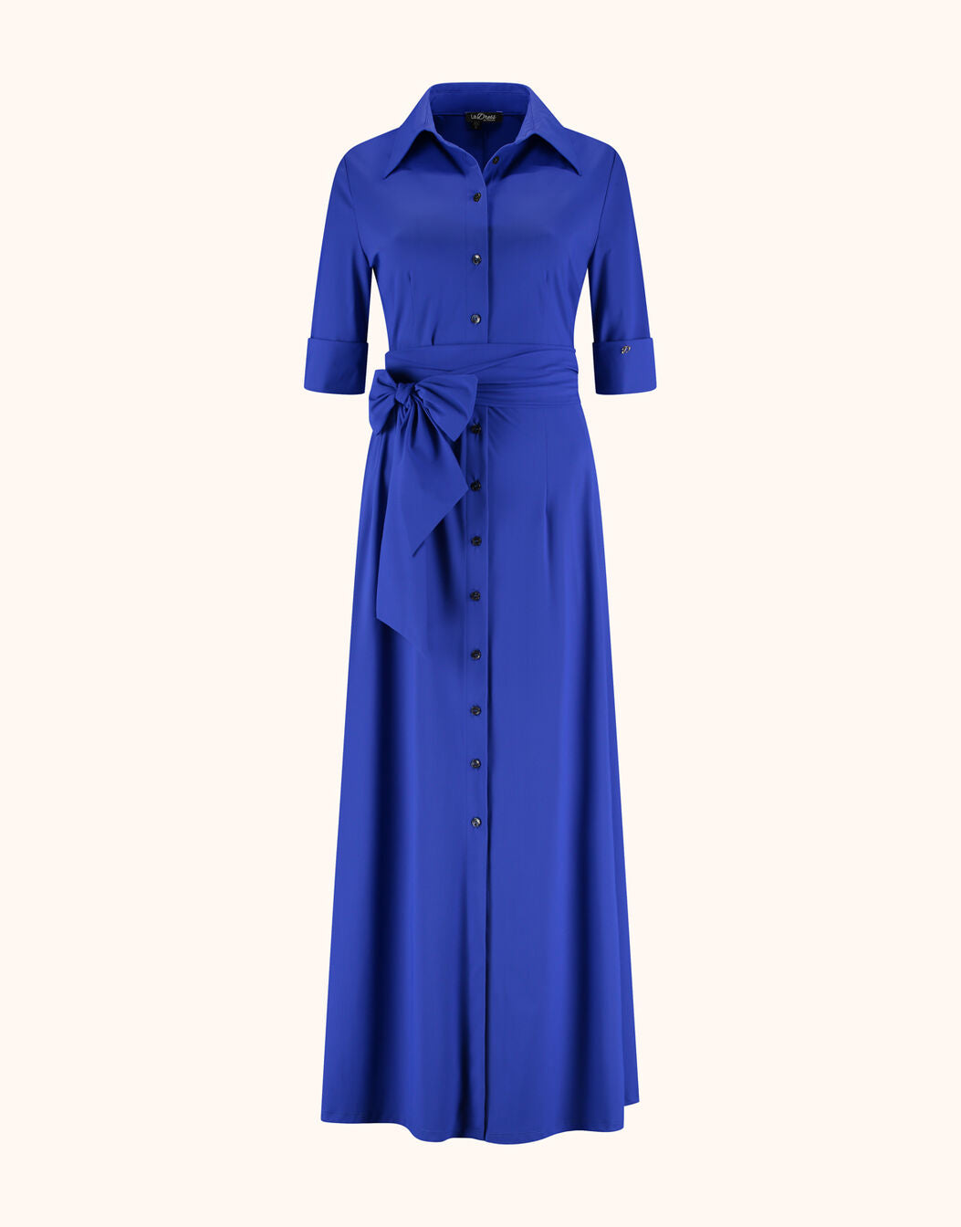 Packshot of the Margot Marine Blue dress in jersey lycra with a collar and tie belt.