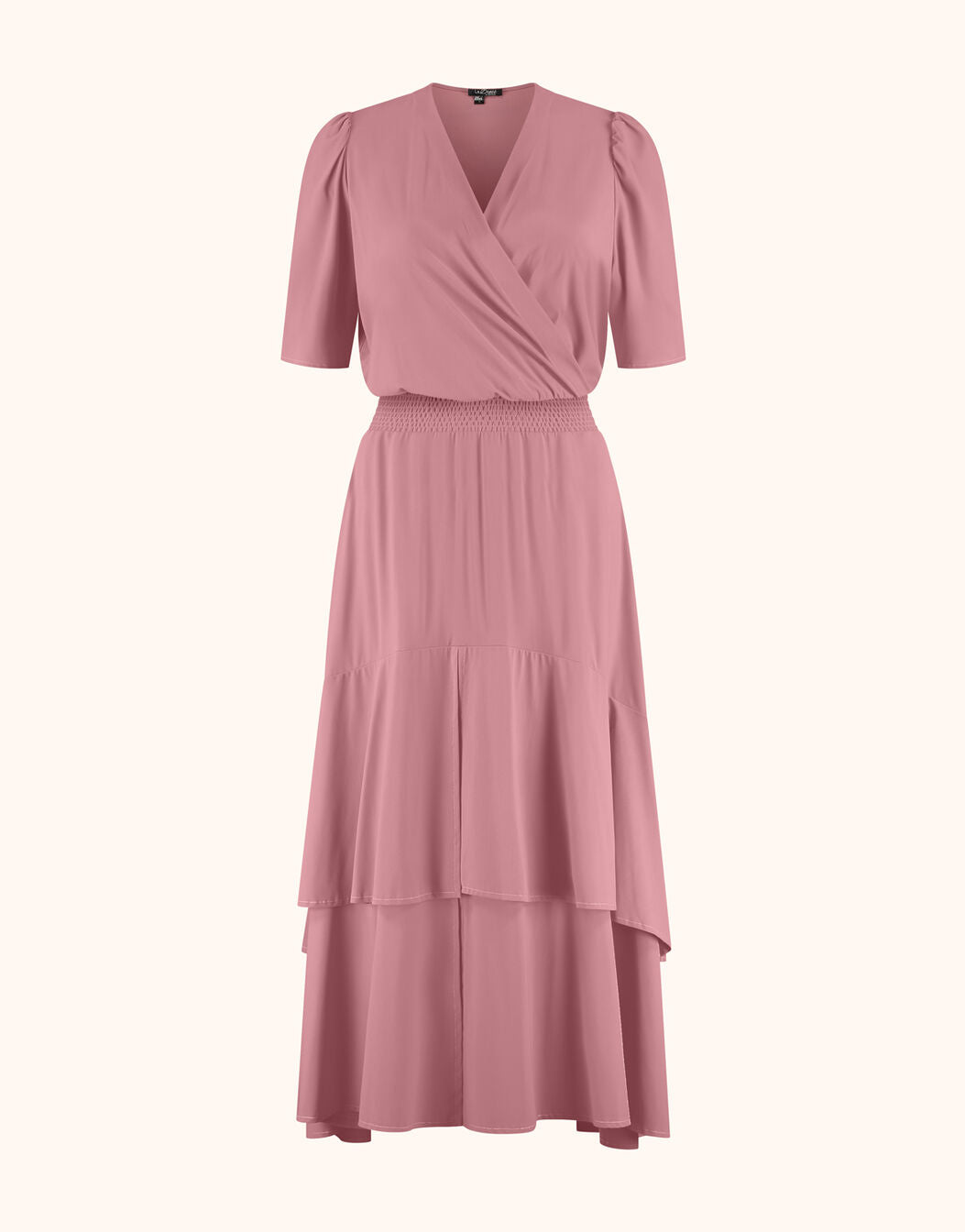 Packshot of the Lea Dusty Pink dress in jersey lycra with a wrap front and tiered hem.