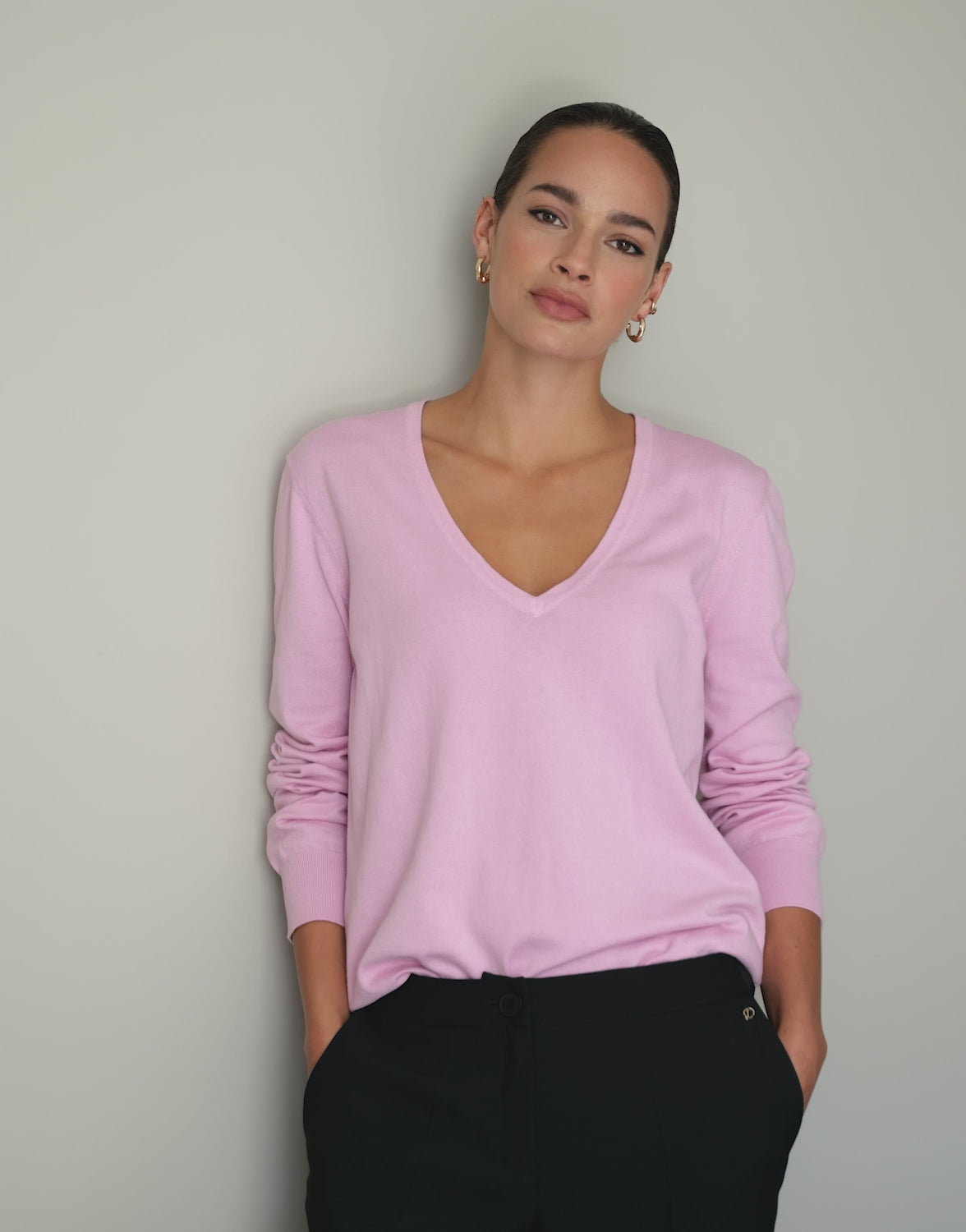 Video of a model wearing the Loretta Pale Rose jumper in organic cotton knit.