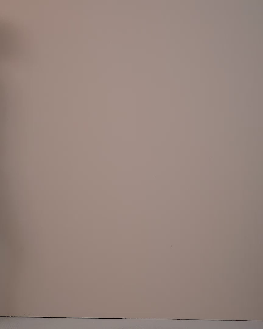 Video of a model wearing the Tilda Lime blouse in satin, seen from the back.