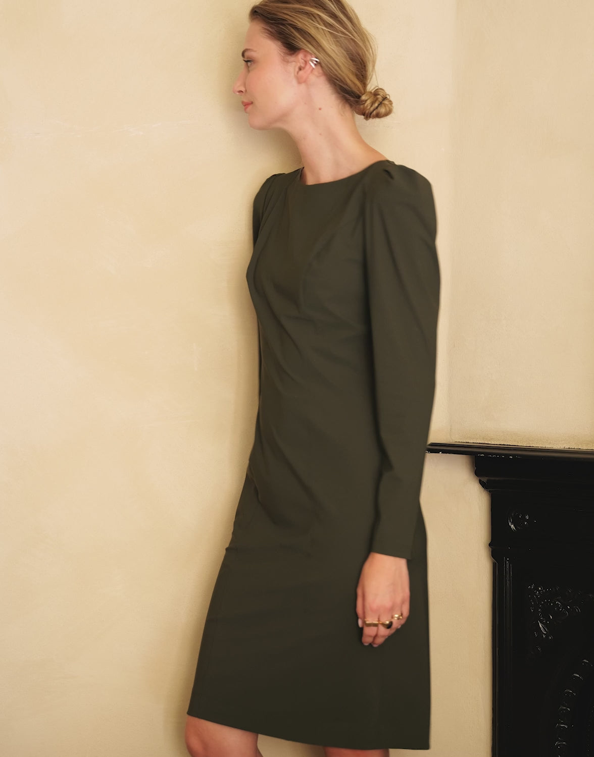 Video of a model wearing the Enya Deep Moss dress in jersey lycra with long sleeves.