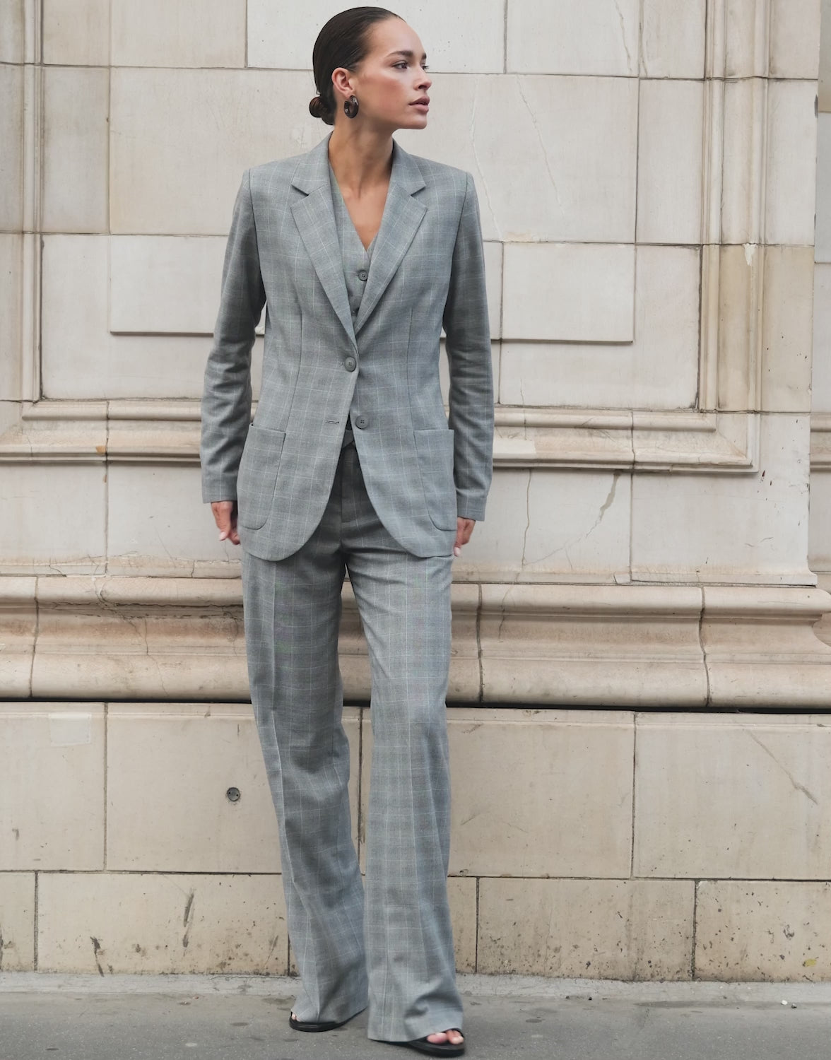 Video of a model wearing the Naples Light Grey Check trousers in stretch woven.