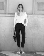 Video of a model wearing the Seoul Ivory trousers in crepe satin with a tapered leg.