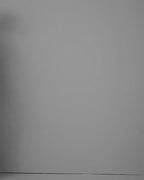 Video of a model wearing the Esmee Black blouse in jersey lycra, seen from the side.